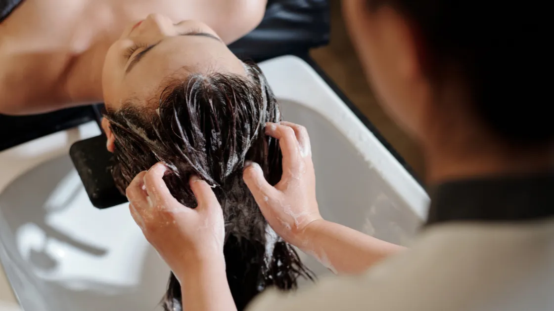 having hair treatment